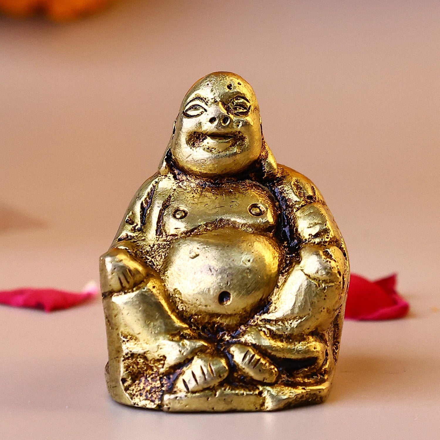 Brass Laughing Buddha Sitting on a Chair