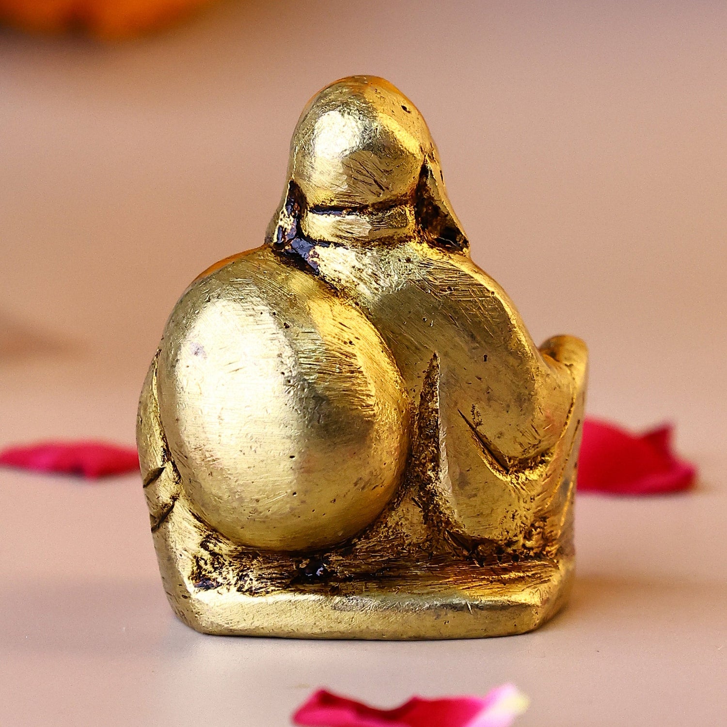 Brass Laughing Buddha Sitting on a Chair